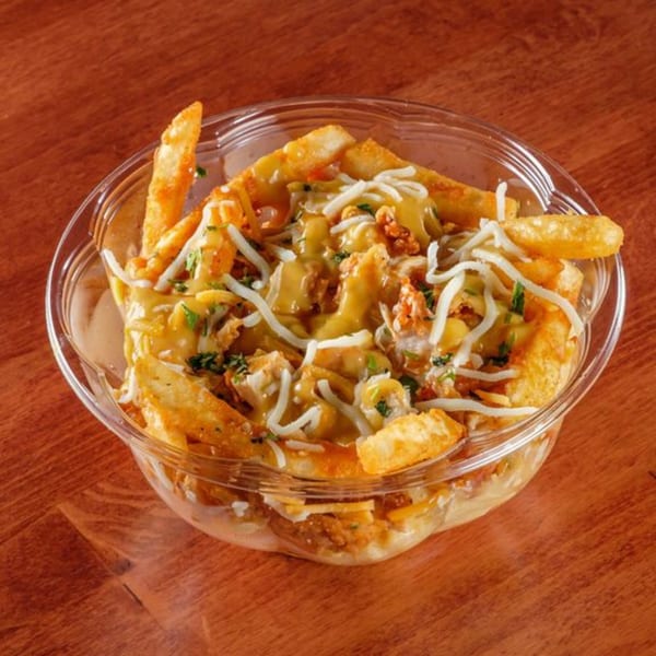 Al Tacos Locos' Mexican poutine with crispy fries, melted cheese, gravy, and chopped chicken.
